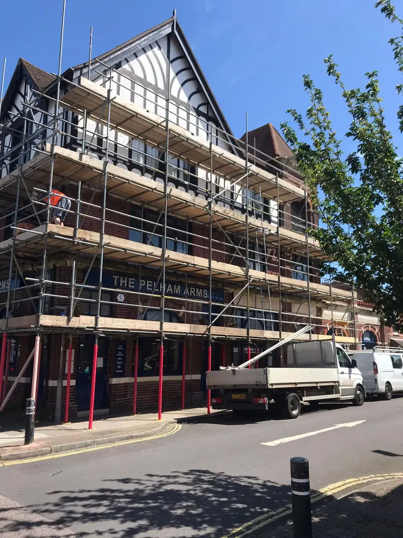 Pelham Arms corner view — multi-lift scaffold with loading bay